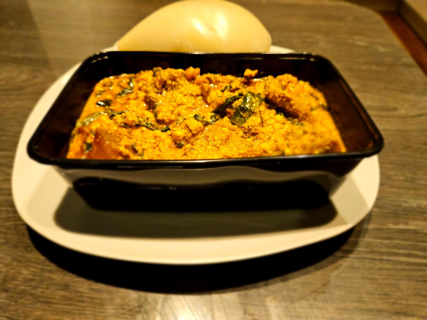 Pounded yam and Egusi (melon seed) soup (Chicken)