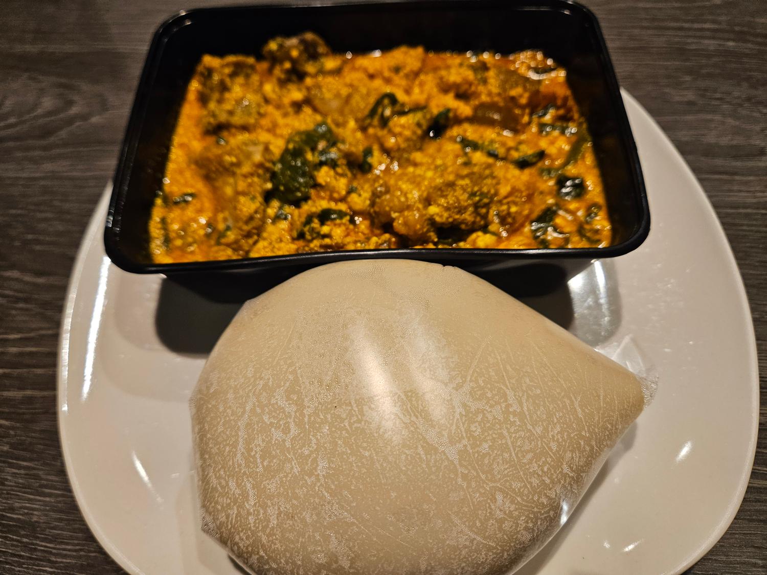 Pounded yam and Egusi (melon seed) soup (Mackerel)