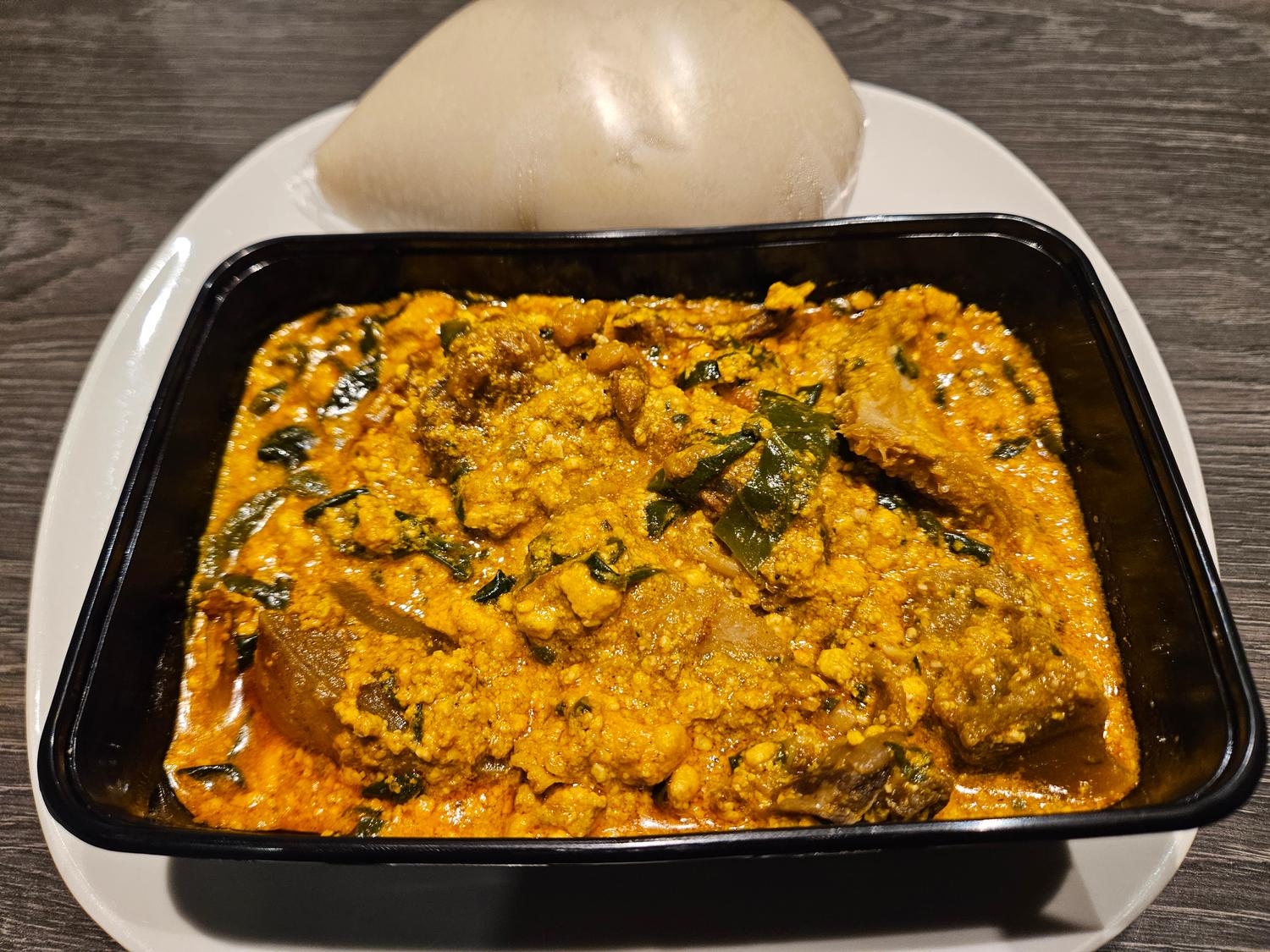 Pounded yam and Egusi (melon seed) soup 