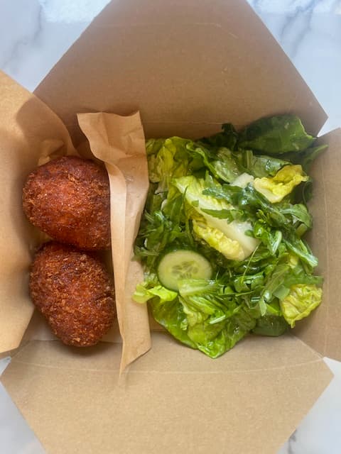 Lunch salad with arancini