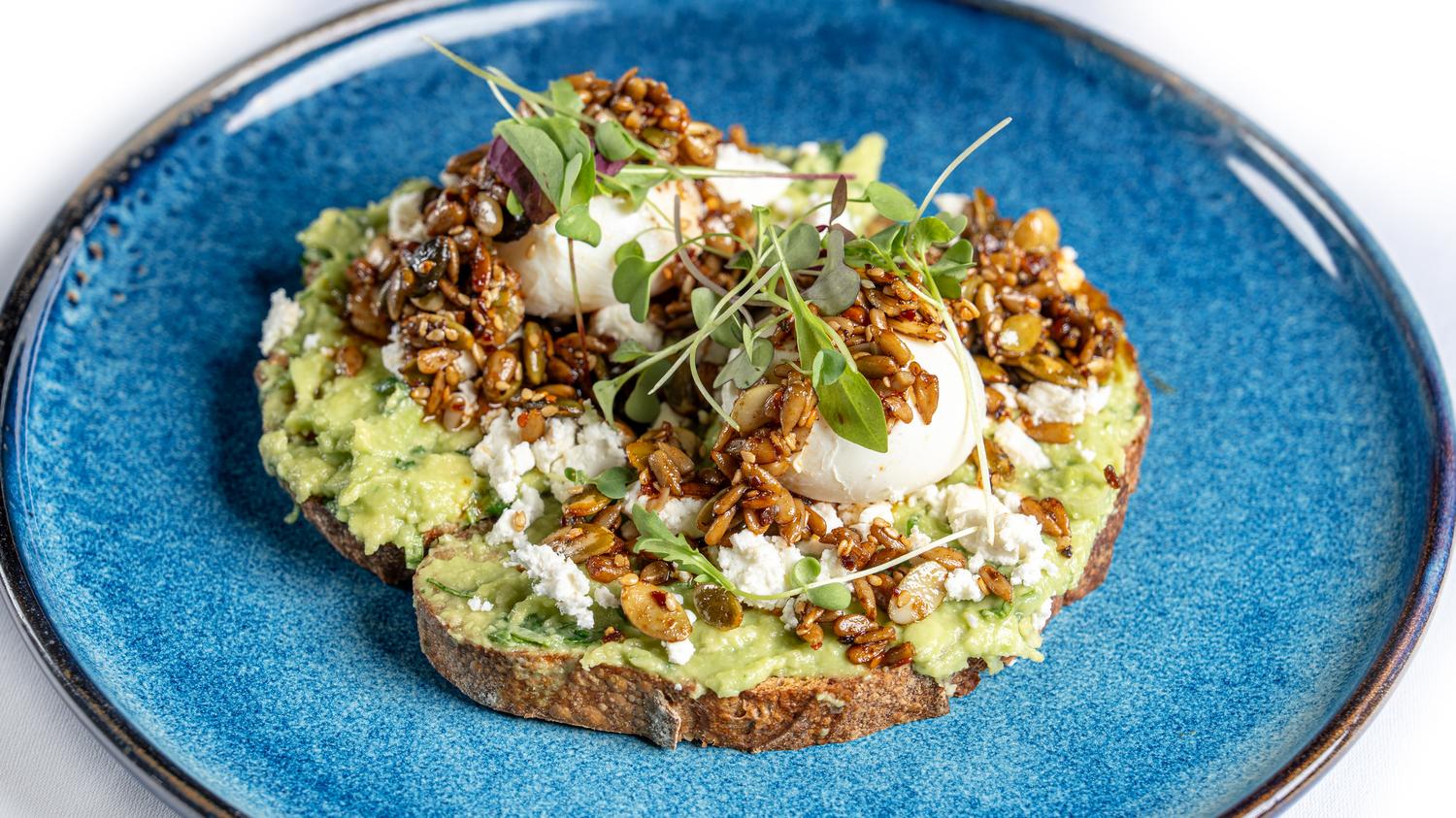 Avo smash with poached eggs, feta & peanut rayu