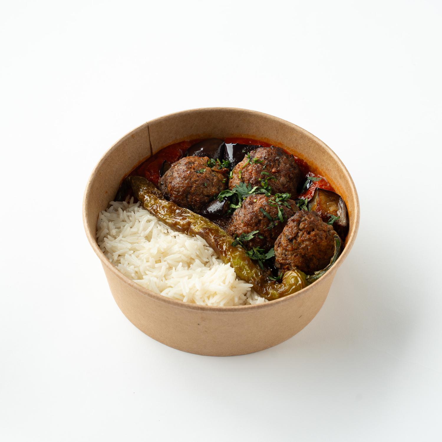 Aubergine musakka with meatballs and rice